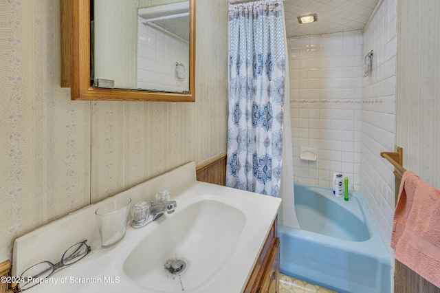 bathroom with shower / tub combo with curtain and vanity