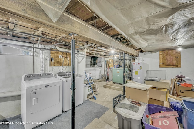 basement with gas water heater and washing machine and clothes dryer