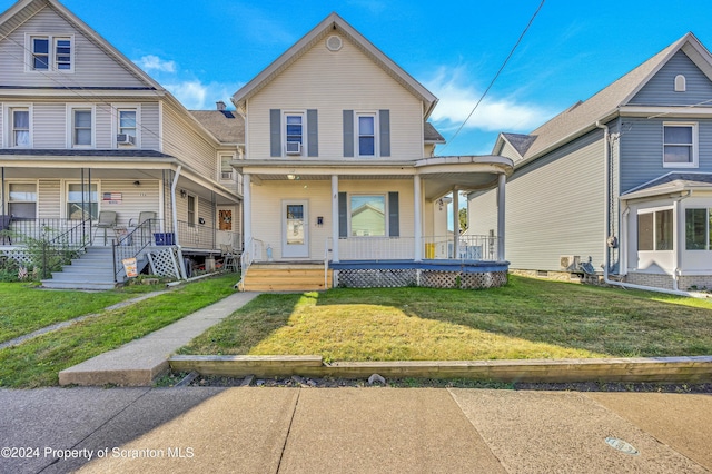 view of front of property with a front yard and a porch