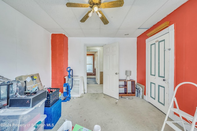 miscellaneous room featuring a paneled ceiling and ceiling fan