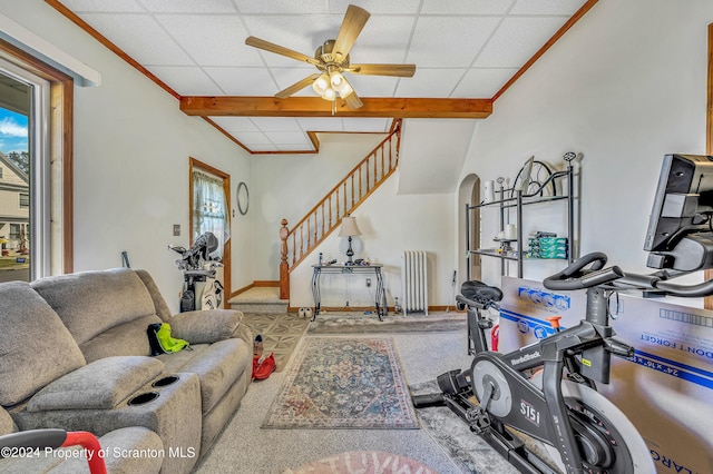 interior space featuring ceiling fan, a drop ceiling, radiator, and vaulted ceiling