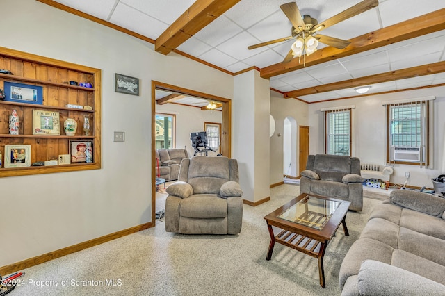 living room featuring a paneled ceiling, cooling unit, ceiling fan, and a healthy amount of sunlight