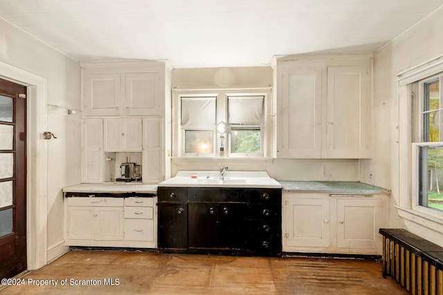 kitchen with sink and white cabinets