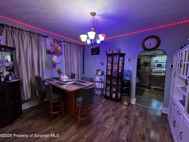 1423 Penn Ave, Scranton, PA 18509 - dining room featuring a chandelier, dark wood-style floors, and baseboards