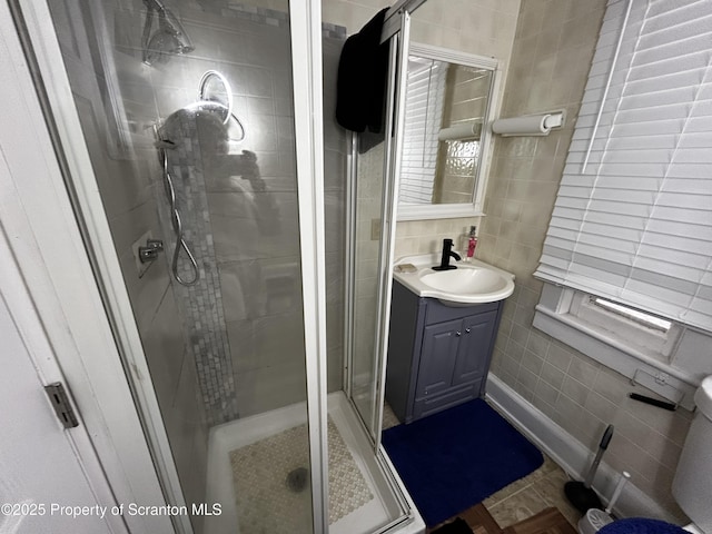 1423 Penn Ave, Scranton, PA 18509 - full bathroom featuring tile walls, a shower stall, and vanity