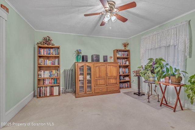 misc room with radiator, light carpet, ceiling fan, and crown molding