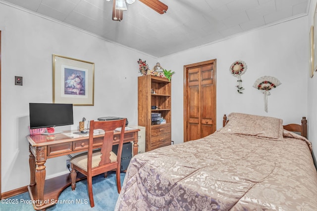 bedroom featuring carpet floors, ceiling fan, and ornamental molding