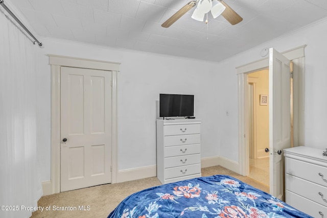 bedroom with ceiling fan, crown molding, and light colored carpet