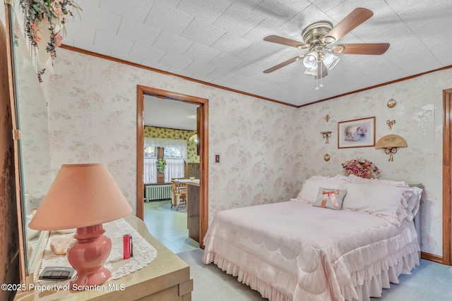 carpeted bedroom featuring radiator, ceiling fan, and crown molding