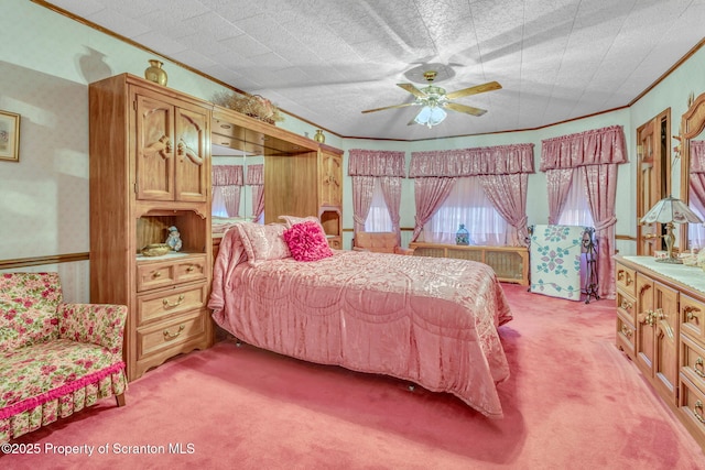 carpeted bedroom with radiator, ceiling fan, and crown molding