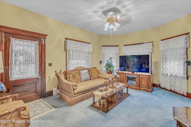 living room featuring ceiling fan and light carpet