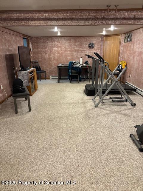exercise room with wood walls
