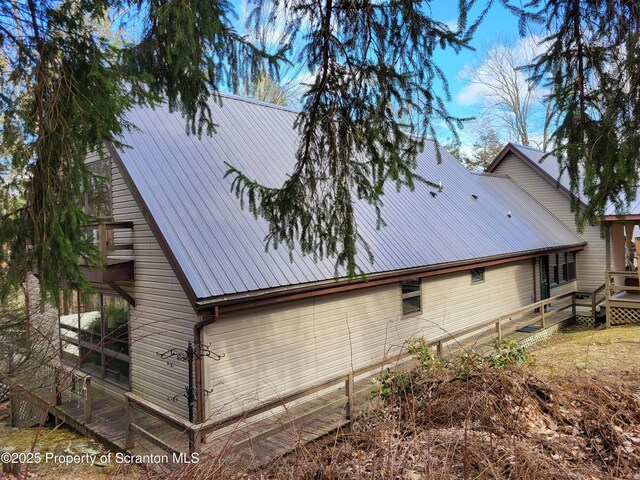 1445 Heart Lake Rd, Scott Twp, PA 18433 - view of side of property featuring a metal roof and a wooden deck