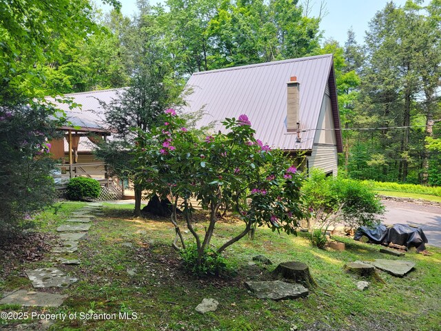 1445 Heart Lake Rd, Scott Twp, PA 18433 - view of home's exterior featuring a metal roof and a chimney