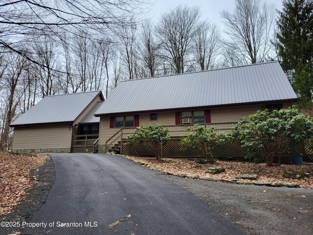 1445 Heart Lake Rd, Scott Twp, PA 18433 - view of front facade featuring a metal roof and driveway