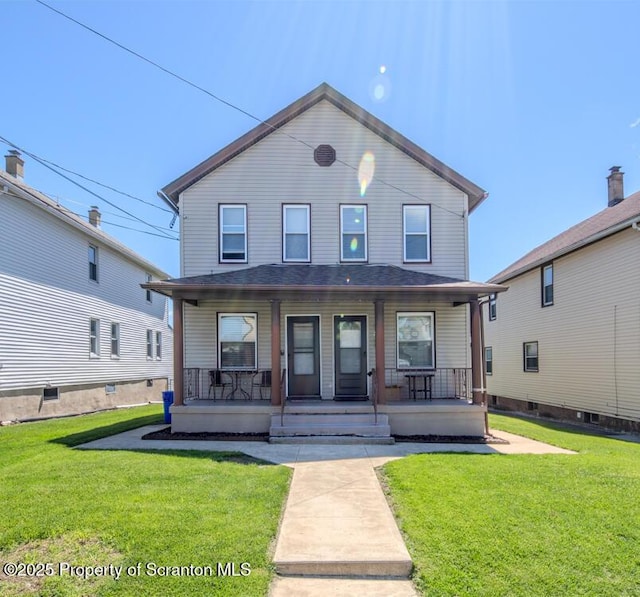 view of front of home with a porch and a front yard