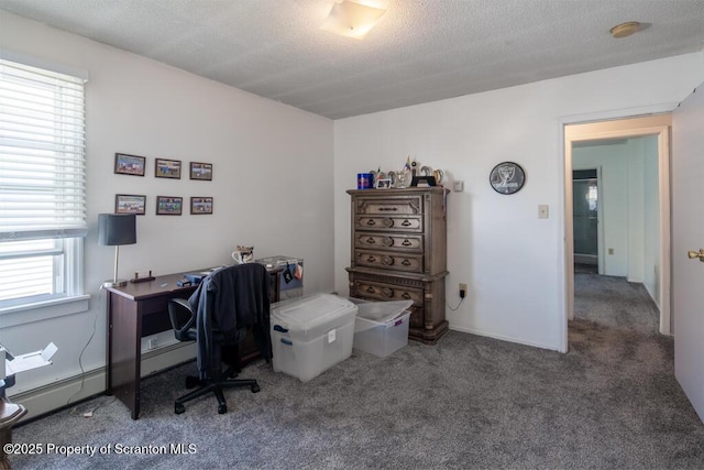 carpeted office with a textured ceiling