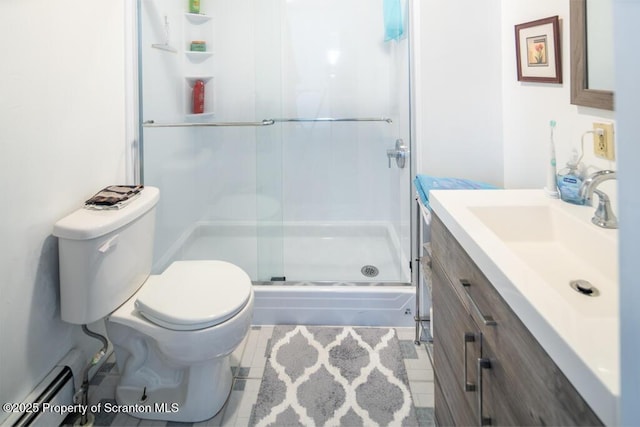 full bath with a baseboard heating unit, a stall shower, toilet, vanity, and tile patterned floors
