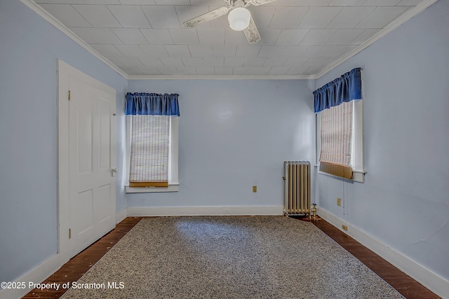 445 Leggett St, Scranton, PA 18508 - unfurnished room with radiator heating unit, crown molding, ceiling fan, and wood finished floors