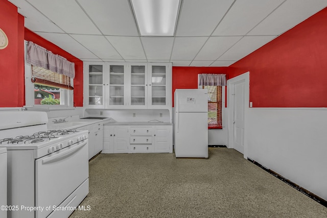 445 Leggett St, Scranton, PA 18508 - kitchen featuring white appliances, a drop ceiling, white cabinets, light countertops, and glass insert cabinets