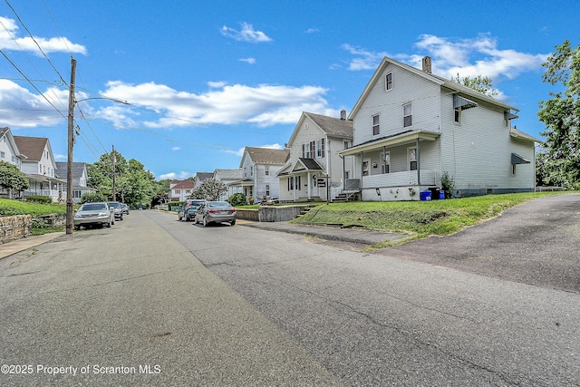 445 Leggett St, Scranton, PA 18508 - view of asphalt road featuring a residential view, sidewalks, and street lighting