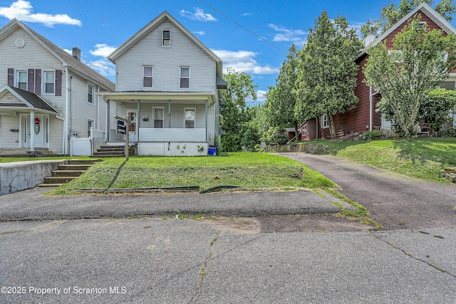 445 Leggett St, Scranton, PA 18508 - view of front of house featuring covered porch and a front lawn