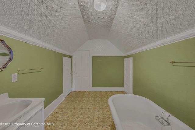 445 Leggett St, Scranton, PA 18508 - full bathroom with a freestanding bath, tile patterned floors, vanity, vaulted ceiling, and crown molding