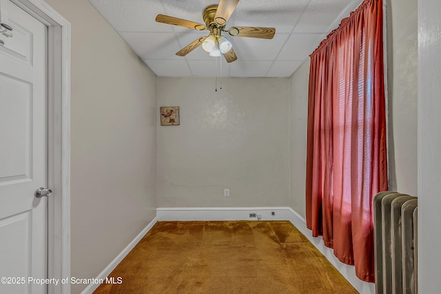 445 Leggett St, Scranton, PA 18508 - carpeted empty room featuring radiator, ceiling fan, and a paneled ceiling