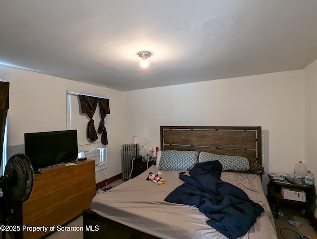 bedroom featuring radiator heating unit