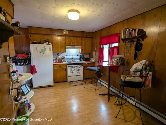 kitchen with white appliances, a baseboard radiator, and light hardwood / wood-style flooring