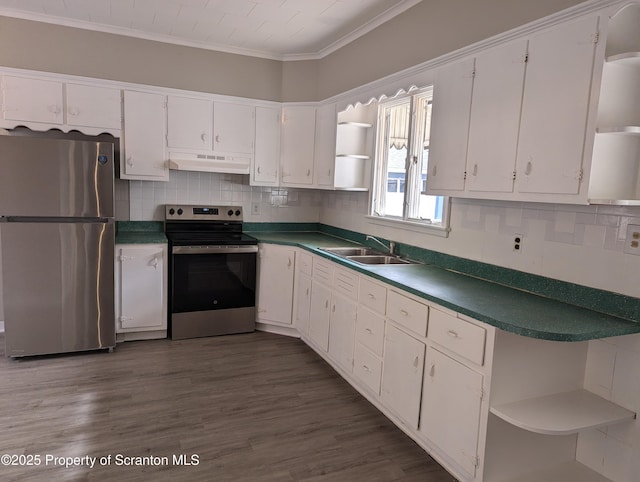 kitchen with white cabinets, range hood, and appliances with stainless steel finishes