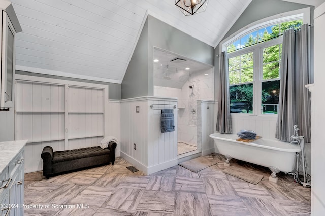 interior space with wooden walls and vaulted ceiling