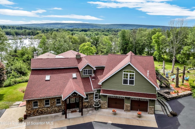 exterior space featuring a mountain view and a garage