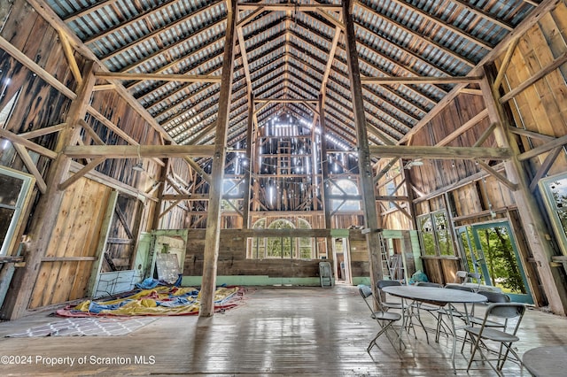 miscellaneous room with high vaulted ceiling