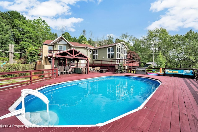 view of swimming pool with a deck