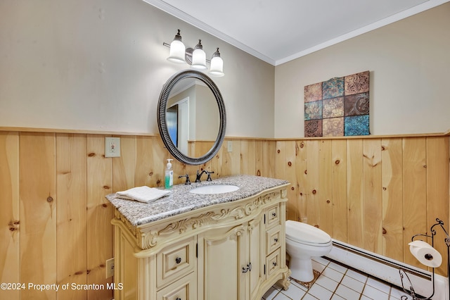 bathroom with tile patterned floors, vanity, a baseboard heating unit, crown molding, and wood walls