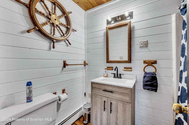 bathroom with vanity, wooden walls, toilet, and wooden ceiling