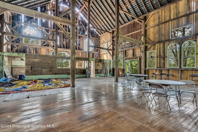 interior space featuring hardwood / wood-style flooring and a towering ceiling