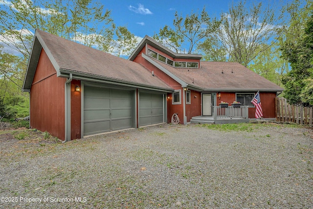 582 Lakeview Dr W, Lake Ariel, PA 18436 - view of front of house featuring an attached garage, gravel driveway, and roof with shingles