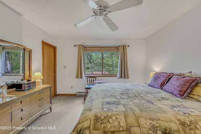 582 Lakeview Dr W, Lake Ariel, PA 18436 - bedroom featuring light carpet, a baseboard heating unit, a textured ceiling, baseboards, and ceiling fan