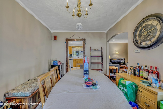 506 N Sumner Ave, Scranton, PA 18504 - dining room featuring a chandelier, arched walkways, and ornamental molding