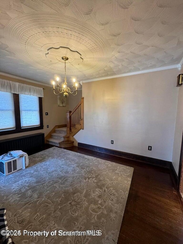 506 N Sumner Ave, Scranton, PA 18504 - unfurnished living room featuring wood finished floors, stairs, a chandelier, ornamental molding, and radiator
