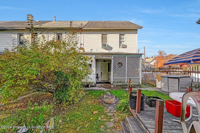 rear view of property with a wooden deck