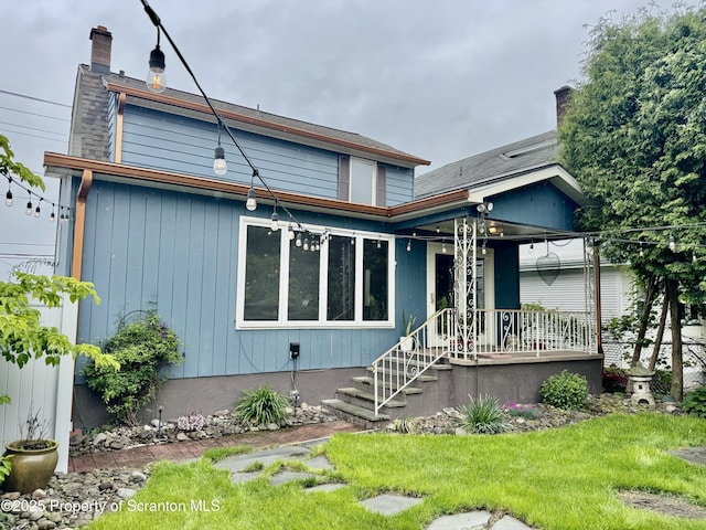 918 Hemlock St, Scranton, PA 18505 - back of property featuring covered porch, a chimney, and a yard