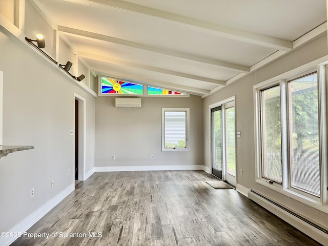 918 Hemlock St, Scranton, PA 18505 - unfurnished room featuring baseboard heating, a wall unit AC, wood finished floors, and baseboards