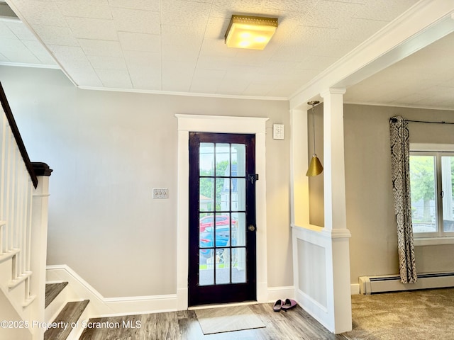918 Hemlock St, Scranton, PA 18505 - foyer entrance featuring crown molding, a baseboard heating unit, stairs, plenty of natural light, and baseboards