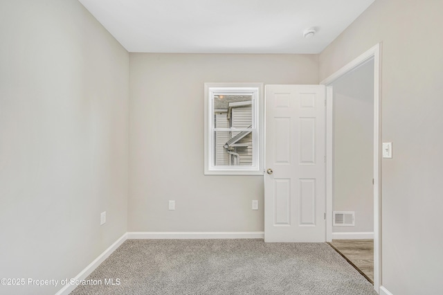 14 Maiden Ln, Susquehanna, PA 18847 - carpeted spare room featuring a smoke detector and baseboards