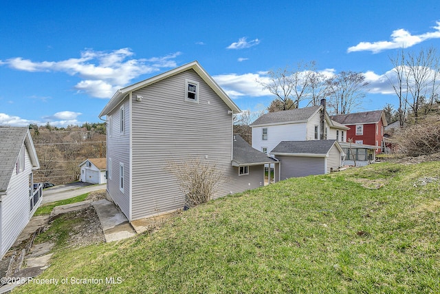 14 Maiden Ln, Susquehanna, PA 18847 - view of property exterior with an outdoor structure and a yard