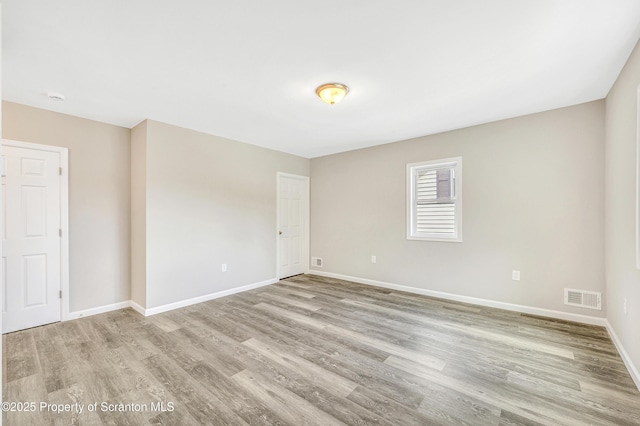 14 Maiden Ln, Susquehanna, PA 18847 - spare room featuring light wood-style floors, baseboards, and a smoke detector