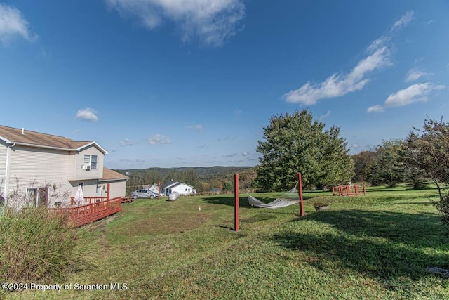 view of yard with a deck